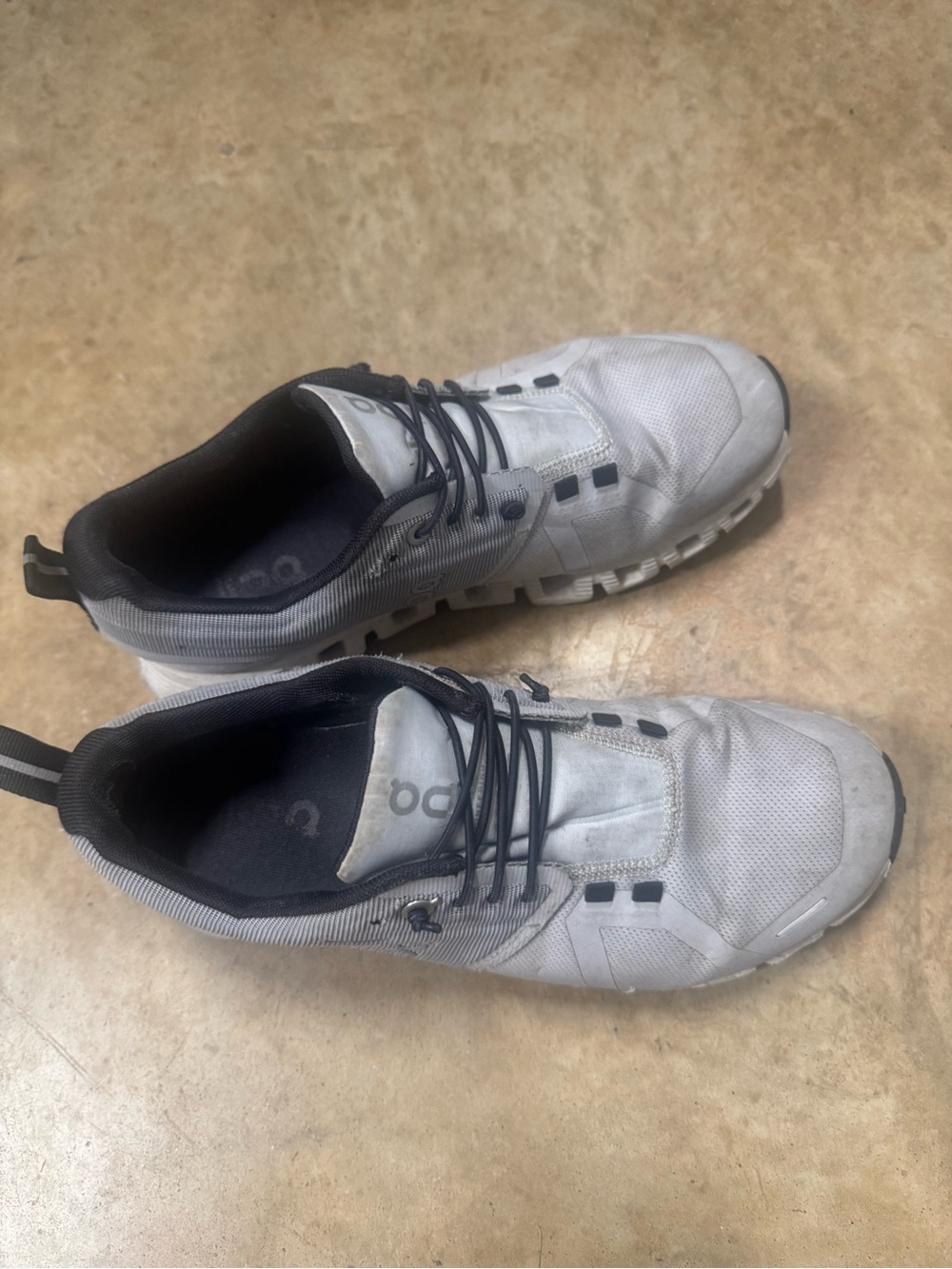 On Running White and Black women’s Athletic Shoes